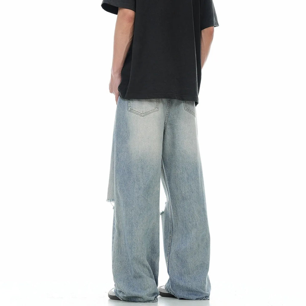 Blue men's ripped jeans with straight-leg cut and zipper fly