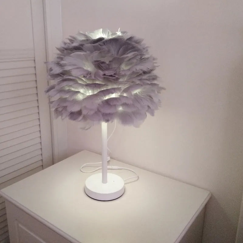 Handmade feather table lamp with metal base, available in white colour, approximately 30cm diameter and 40cm height
