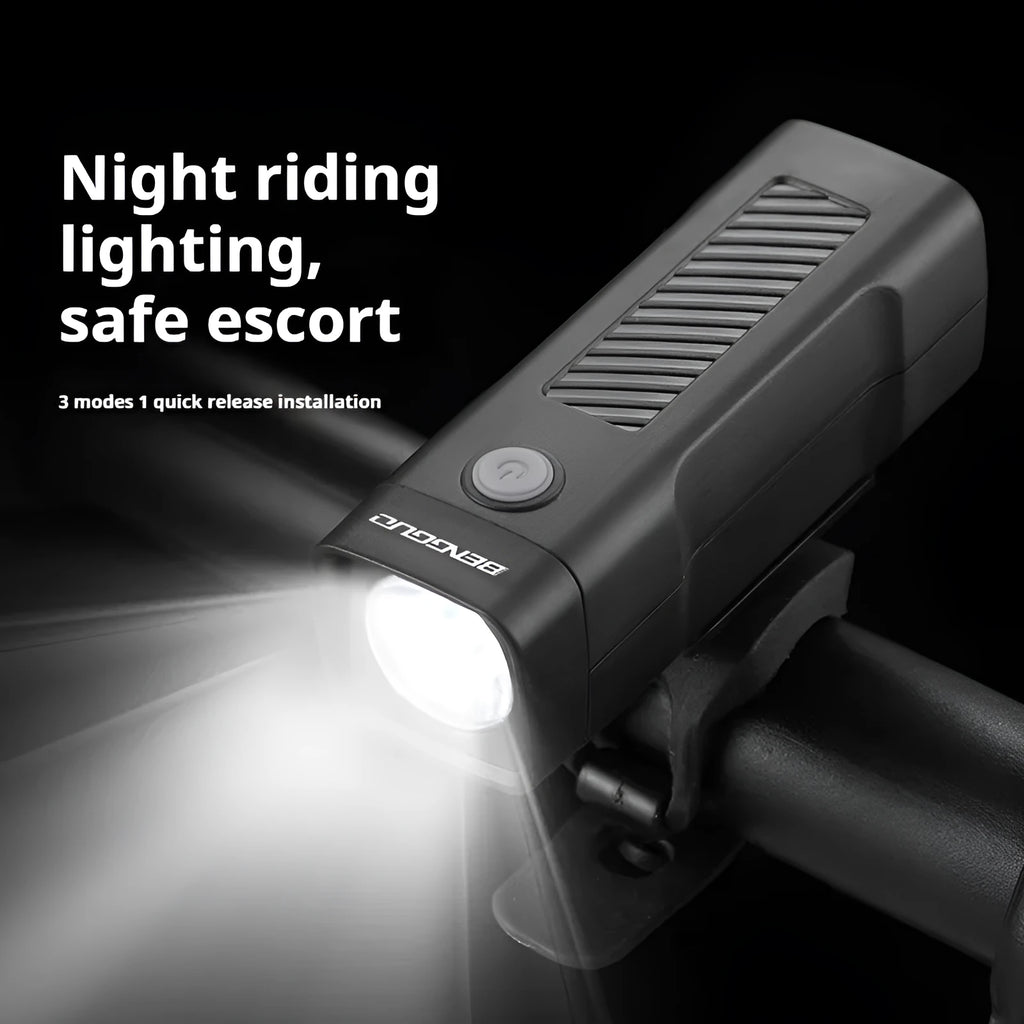 Black USB-rechargeable bicycle headlight with quick-release strap mount on handlebars.