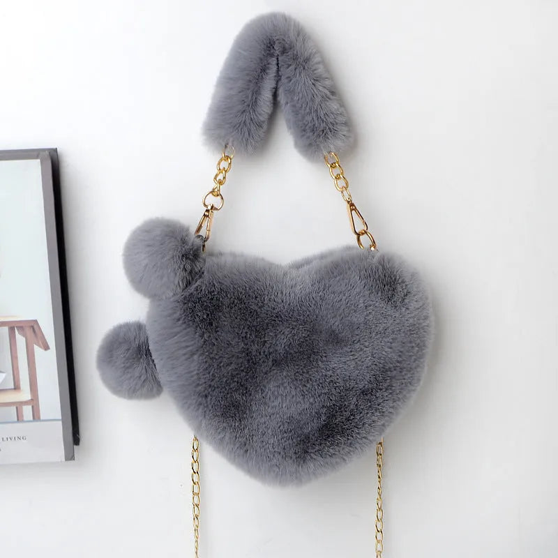 Heart-shaped women's plush handbag with soft texture and detachable shoulder strap in medium size