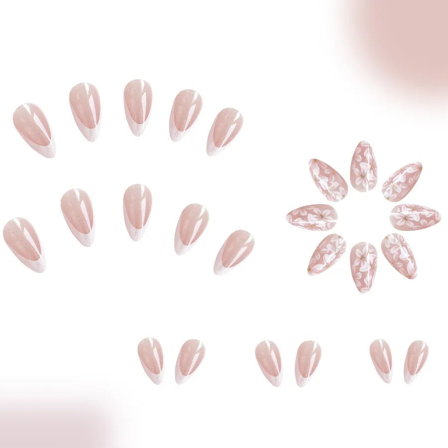Short almond French manicure press-on nails with glitter flower designs in colour C625