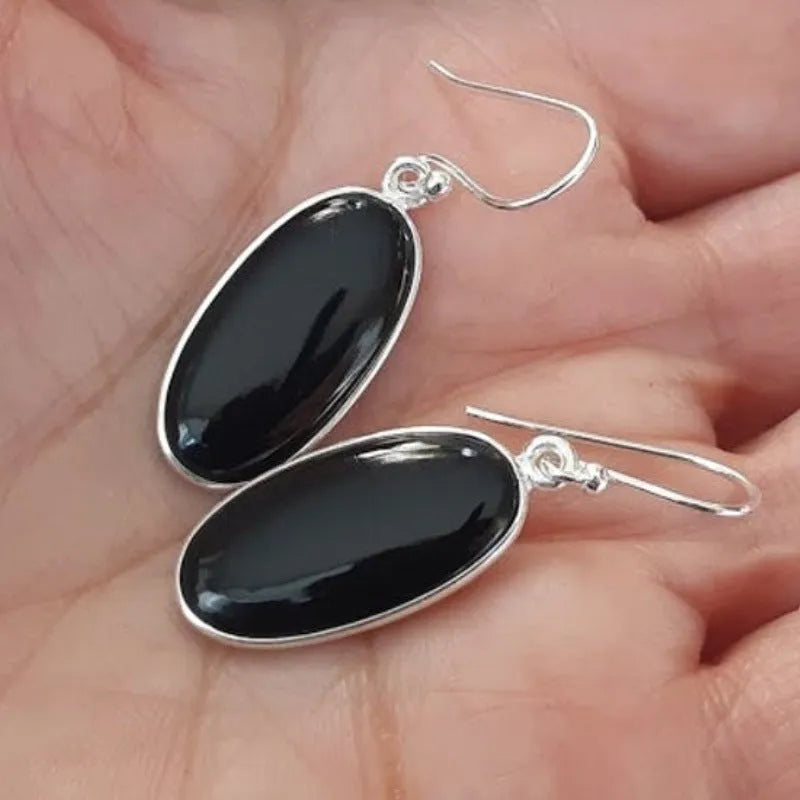Women's earrings with oval black agate pendants on 925 silver and alloy geometric design