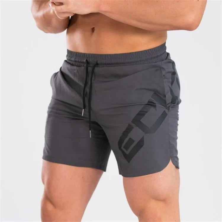 Men's black elastic waist knee-length quick-dry training shorts on a white background.