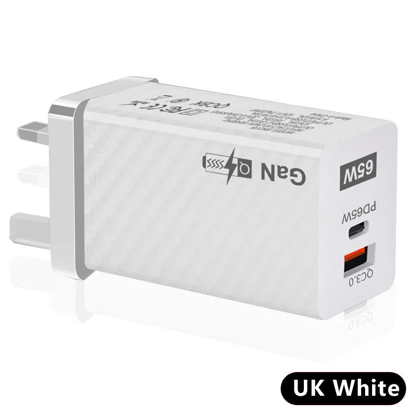 65W Gallium Nitride laptop charger in black with UK plug showing compact dimensions