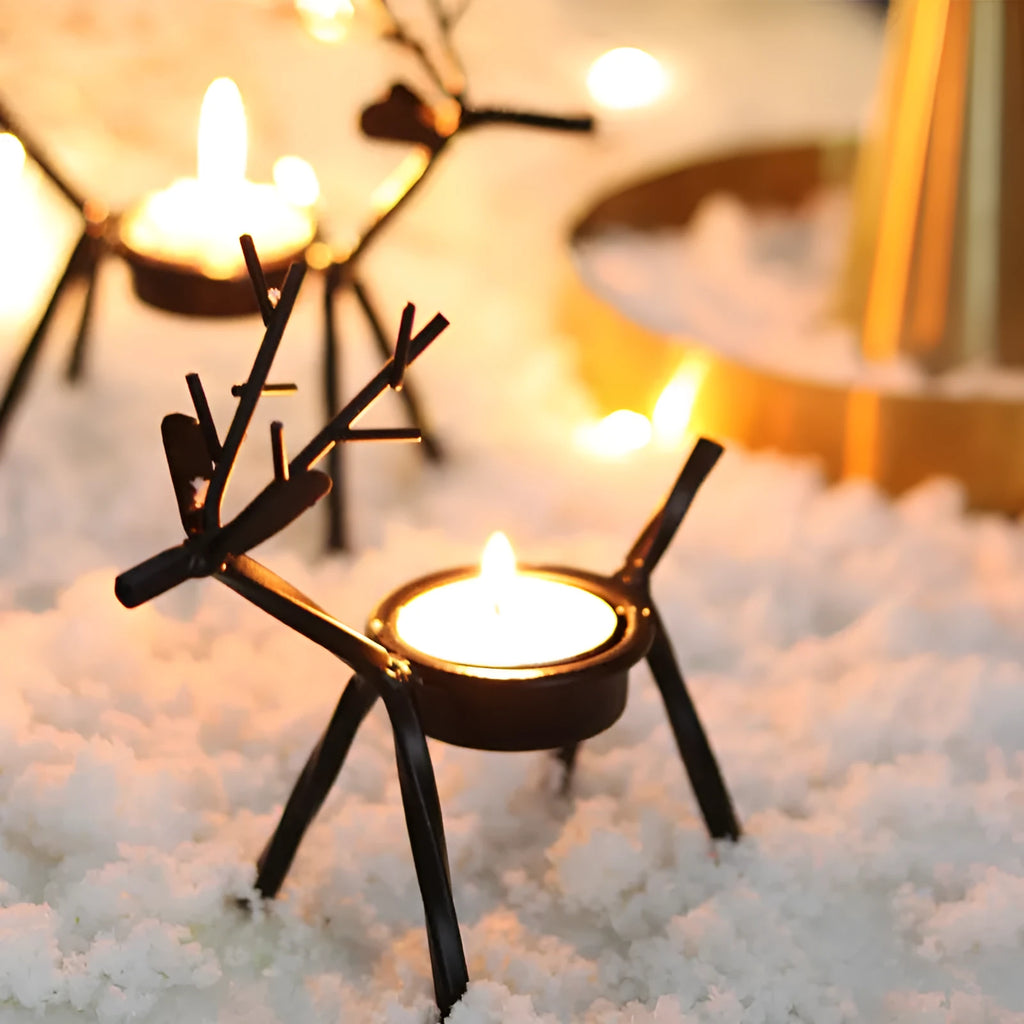 Black iron deer-shaped candlestick holder with fabric decorative elements for Christmas table decoration.