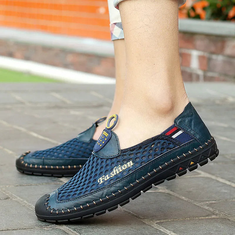 Men's brown mesh casual shoes with round toe and rubber sole on grey background