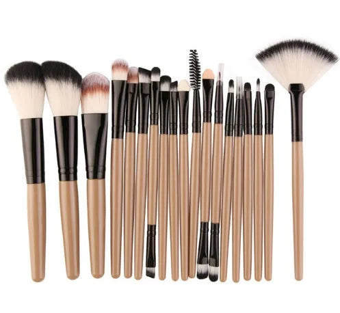 MAANGE 18-piece makeup brush set with fan-shaped cosmetic tools laid out on a table.