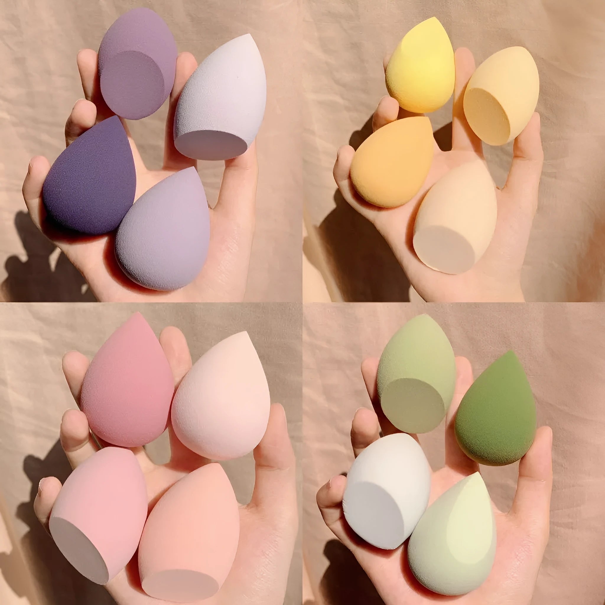 Set of four coloured makeup sponge eggs on a white background