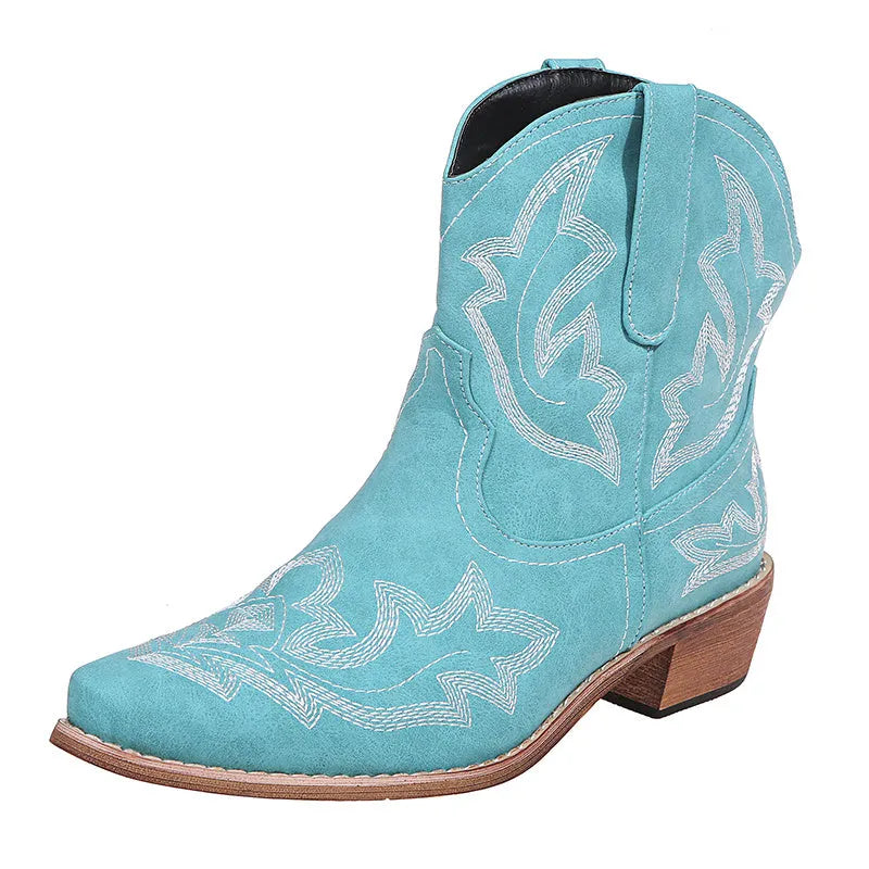 Blue women's cowboy boots with white embroidery, a low wedge heel, and a pointed toe