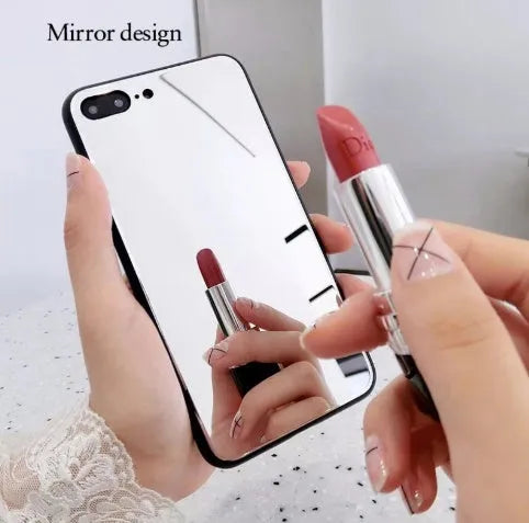 Black mirror iPhone back cover case for iPhone 7 Plus, 8 Plus, and X models on a table.