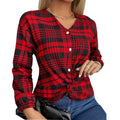 A woman wearing a loose-fitting purple plaid casual shirt with regular sleeves.