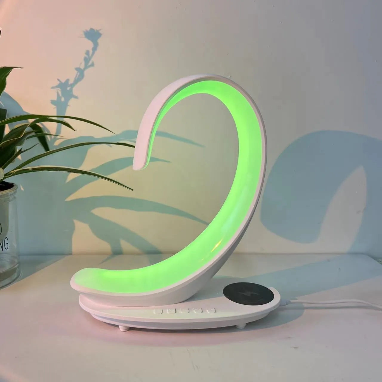 White swan decorative lamp with wireless charging pad and Bluetooth speaker functionality