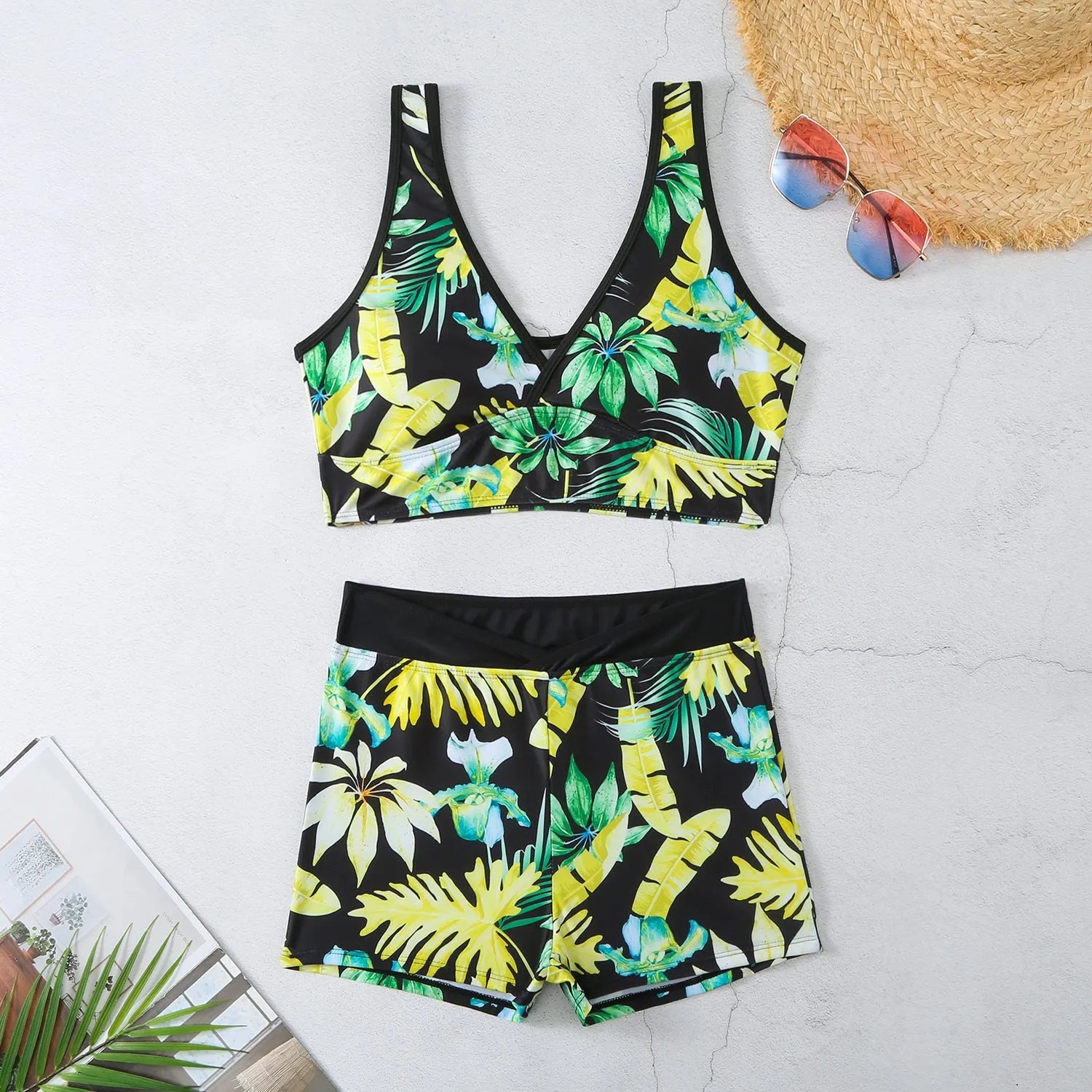 Women's two-piece printed swimsuit set with sleeveless top and boxer shorts in a multi-colour design.