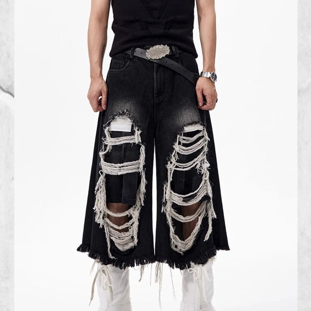 Black women's cropped wide leg jeans with mid-high waist and ripped patch detail