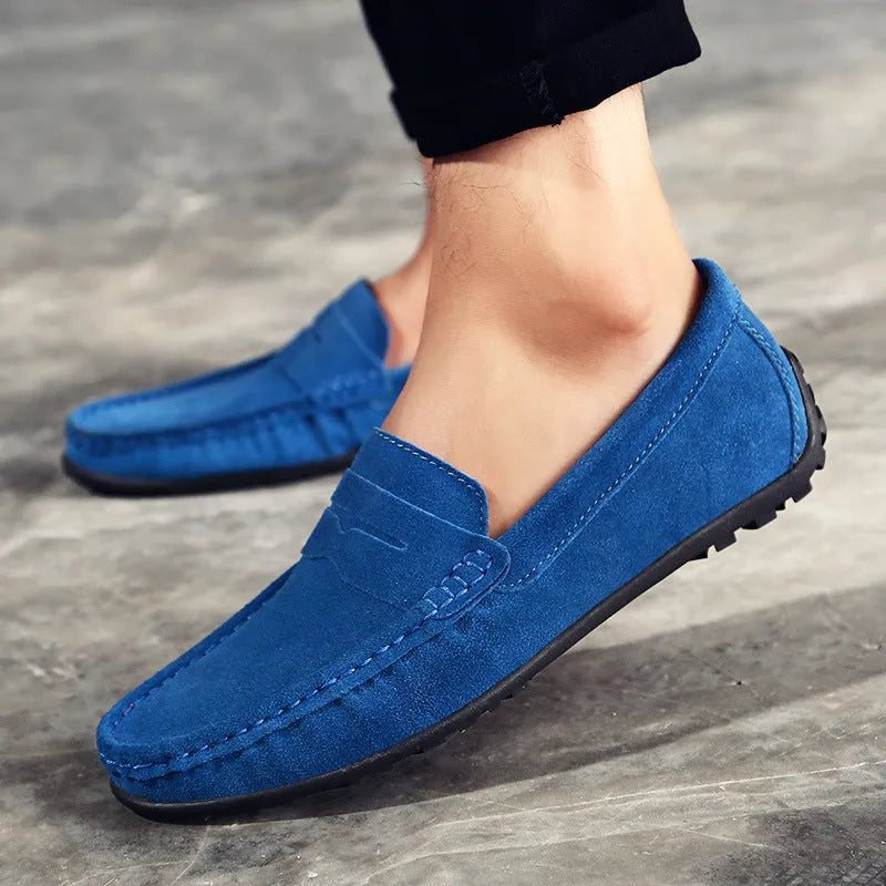 Men's suede Gommino-style loafers in a range of colours on a flat rubber sole.