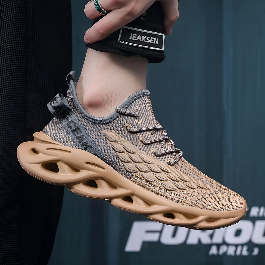 Blade mesh sports shoes in black with low-top design, lace-up closure, and breathable upper