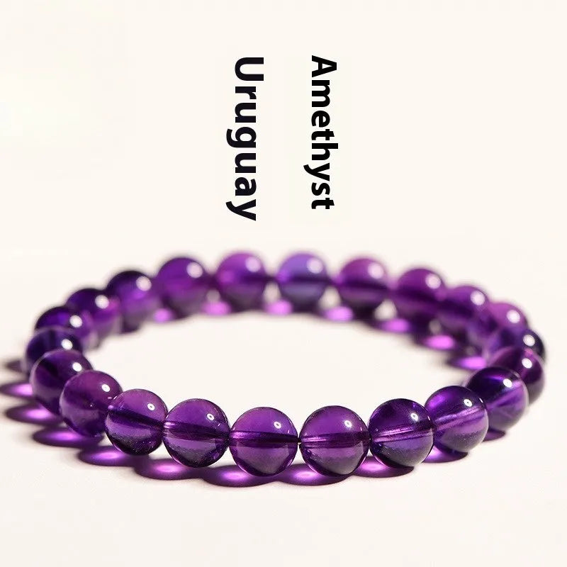 Natural amethyst Uruguay bracelet with scattered beads in various sizes on a wrist.