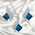 Women's necklace and earring set with cross chain design and glass pendant in alloy with electroplated finish