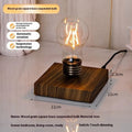 Suspended bulb night lamp on black wood grain base measuring 11cm for desktop decoration