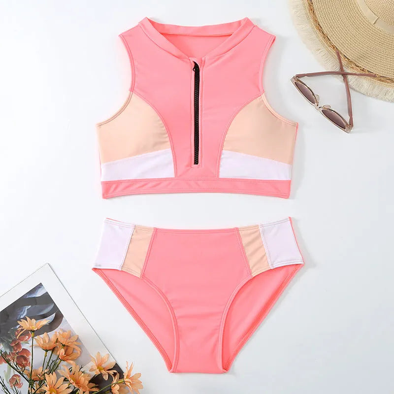 Pink high-waist bikini swimsuit with split-leg briefs and matching bra on a mannequin.