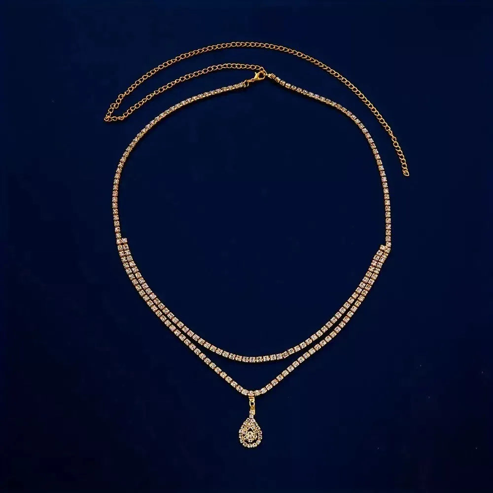 Gold or silver women's waist chain with water drop pendant measuring 115cm length with lobster buckle closure
