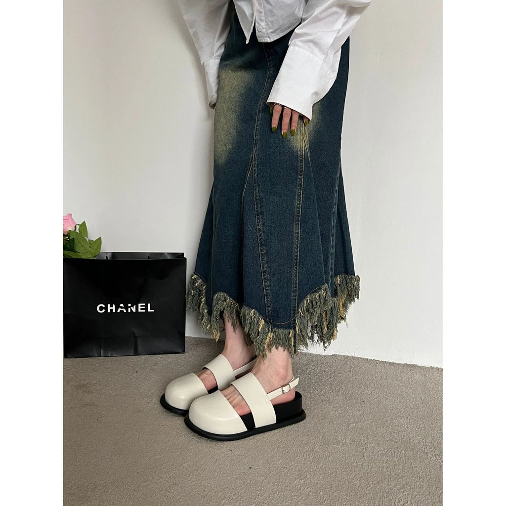 Retro style closed toe sandals with a single ankle buckle strap in apricot colour.