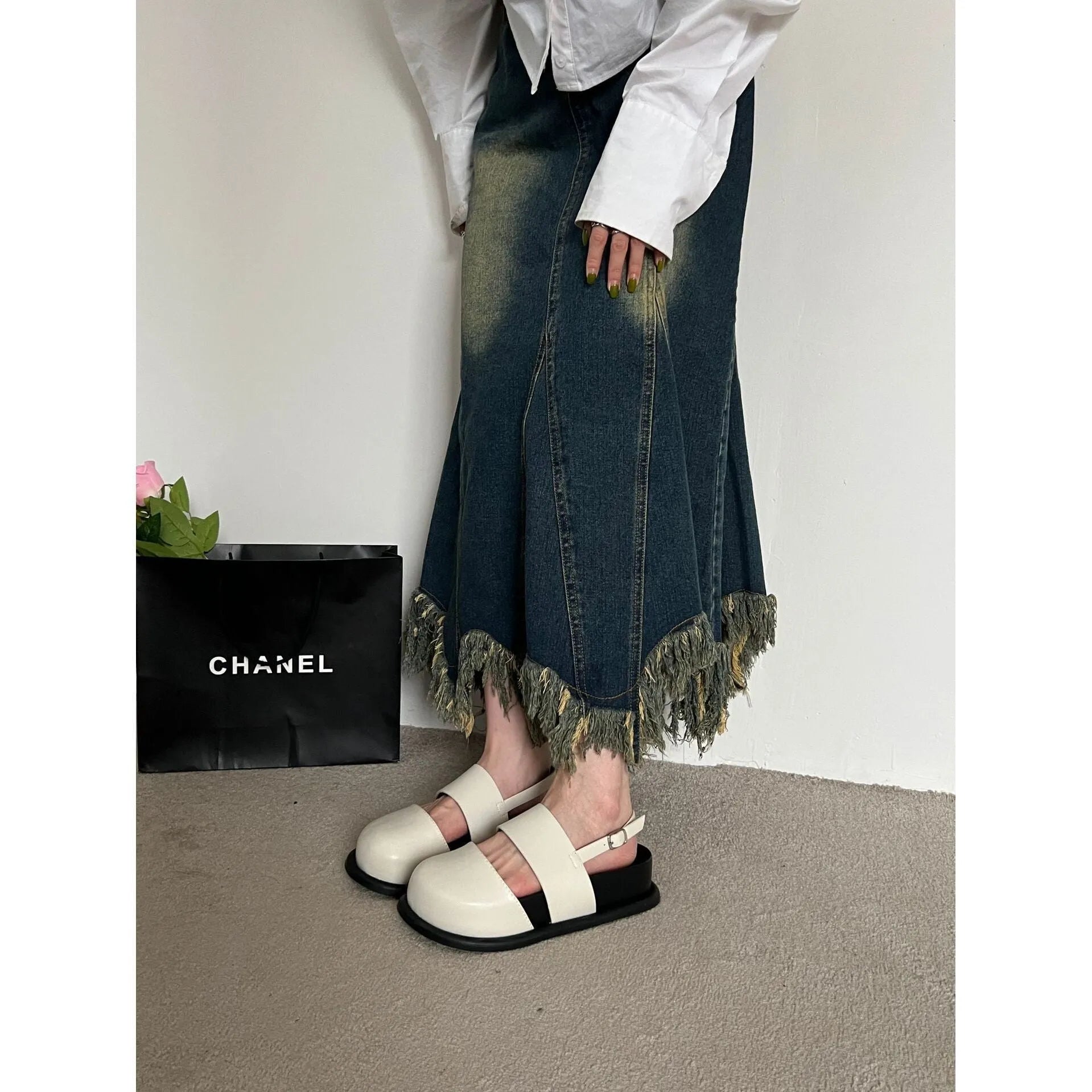 Retro style closed toe sandals with a single ankle buckle strap in apricot colour.