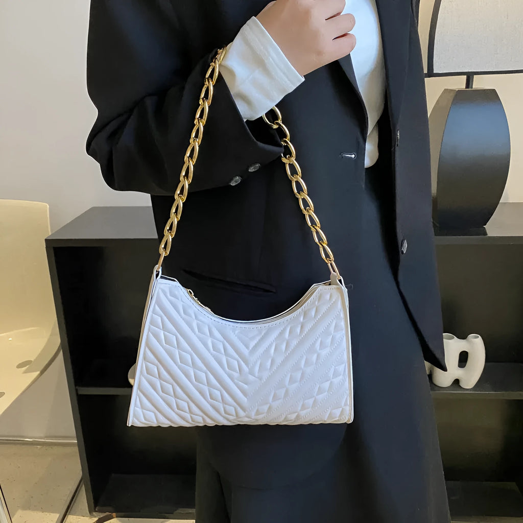 Brown pleated chain shoulder bag showing vertical square shape and adjustable strap