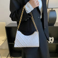 Brown pleated chain shoulder bag showing vertical square shape and adjustable strap