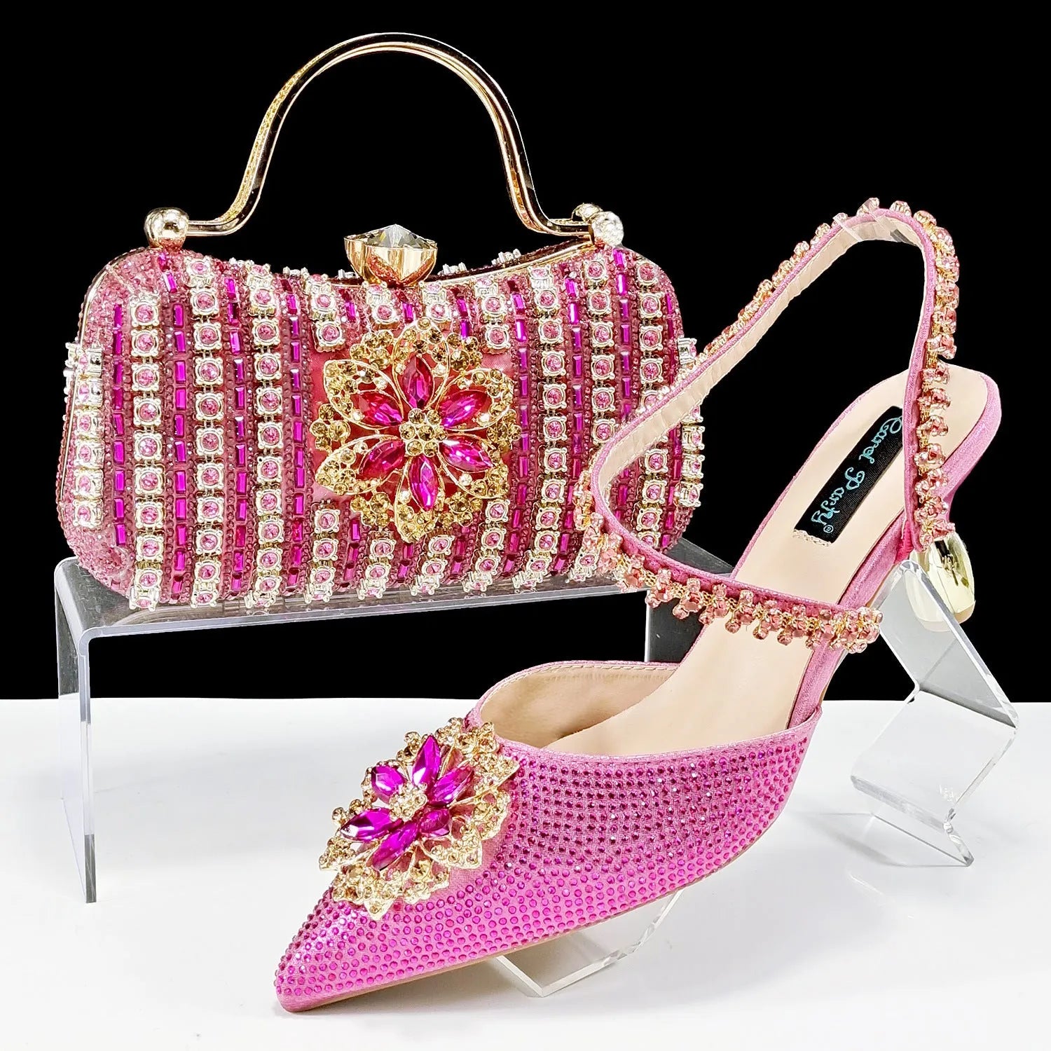 Women's black high heel shoes with matching clutch bag, decorative drill buckle flower ankle chain, and rhinestone details.