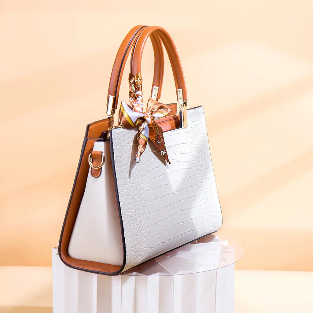 Milky white PU shoulder handbag with horizontal square shape and internal organisational compartments
