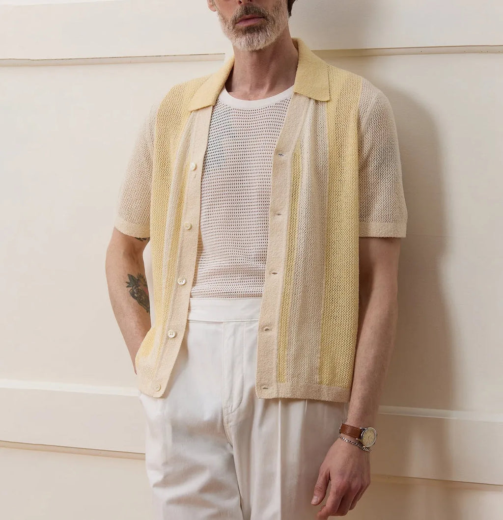 Yellow short-sleeved polo shirt with hollow-out asymmetric design detail on Tencel fabric