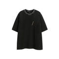 Man wearing a loose black retro short-sleeved cotton T-shirt with an embroidered washed design