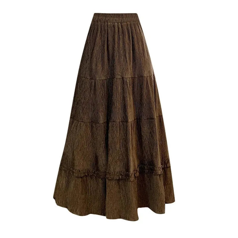 Korean style corduroy A-line midi skirt with an elastic waistband in a solid colour.
