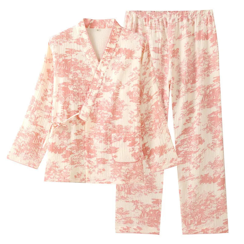 Women's pink cotton gauze long sleeve top and trousers matching loungewear set laid flat.
