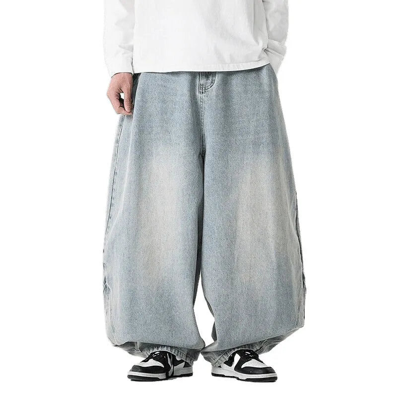 Men's plus-size light blue baggy jeans with a straight leg and zip fly