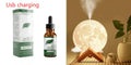 Wood finish lunar humidifier night light showing spherical design with mist output and LED illumination