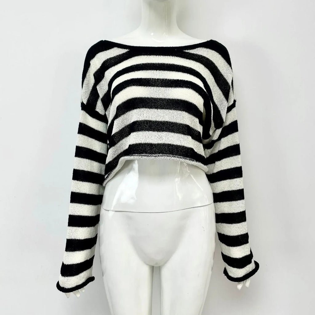Women's black and white striped cropped long sleeve sweater made from mercerised cotton on a model.