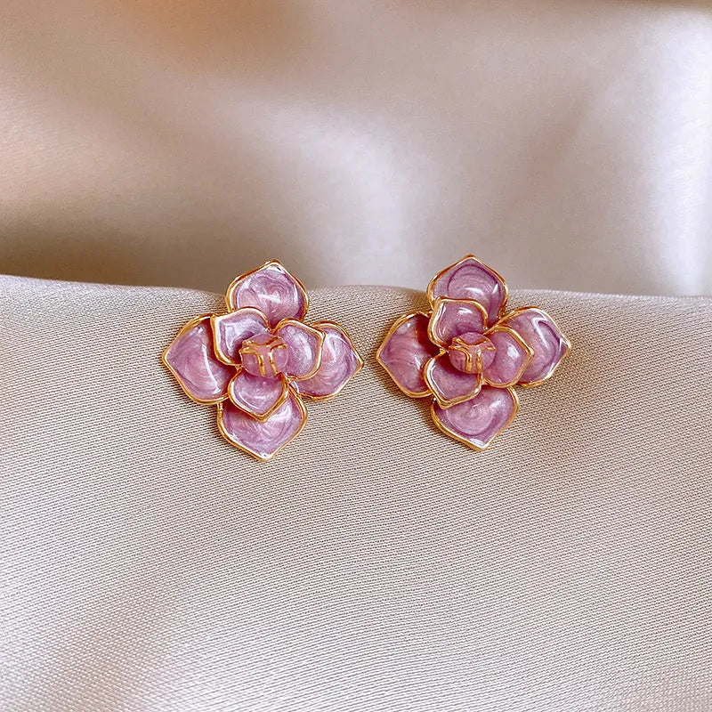 Gold plated purple flower stud earrings with an oil-spot glaze effect on copper