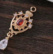Water drop shaped pendant with crown design and micro inlaid zircon detail in electroplated copper.