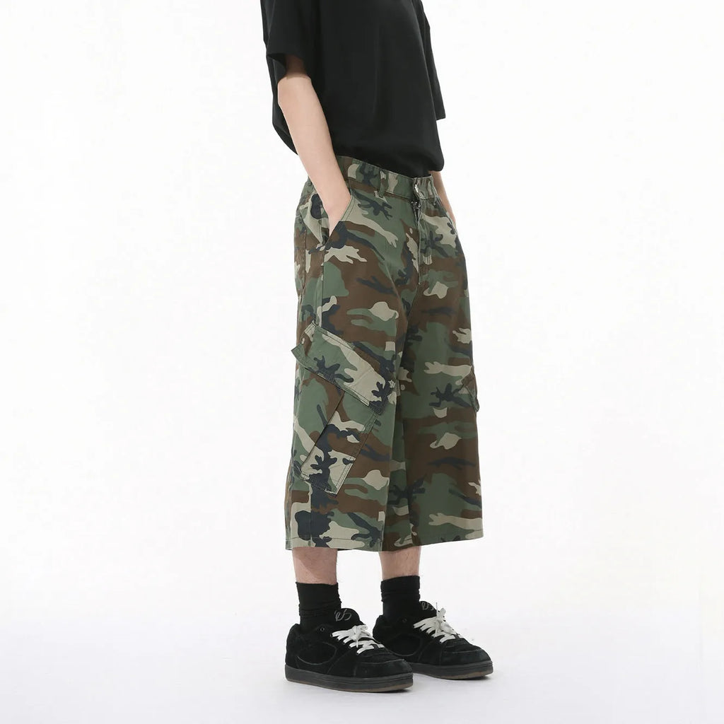 Men's cotton camouflage loose fit jeans with wide leg, cropped length, side stitching, and large pockets.