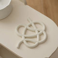 Ceramic heat proof mat with irregular shape and bend and hook design