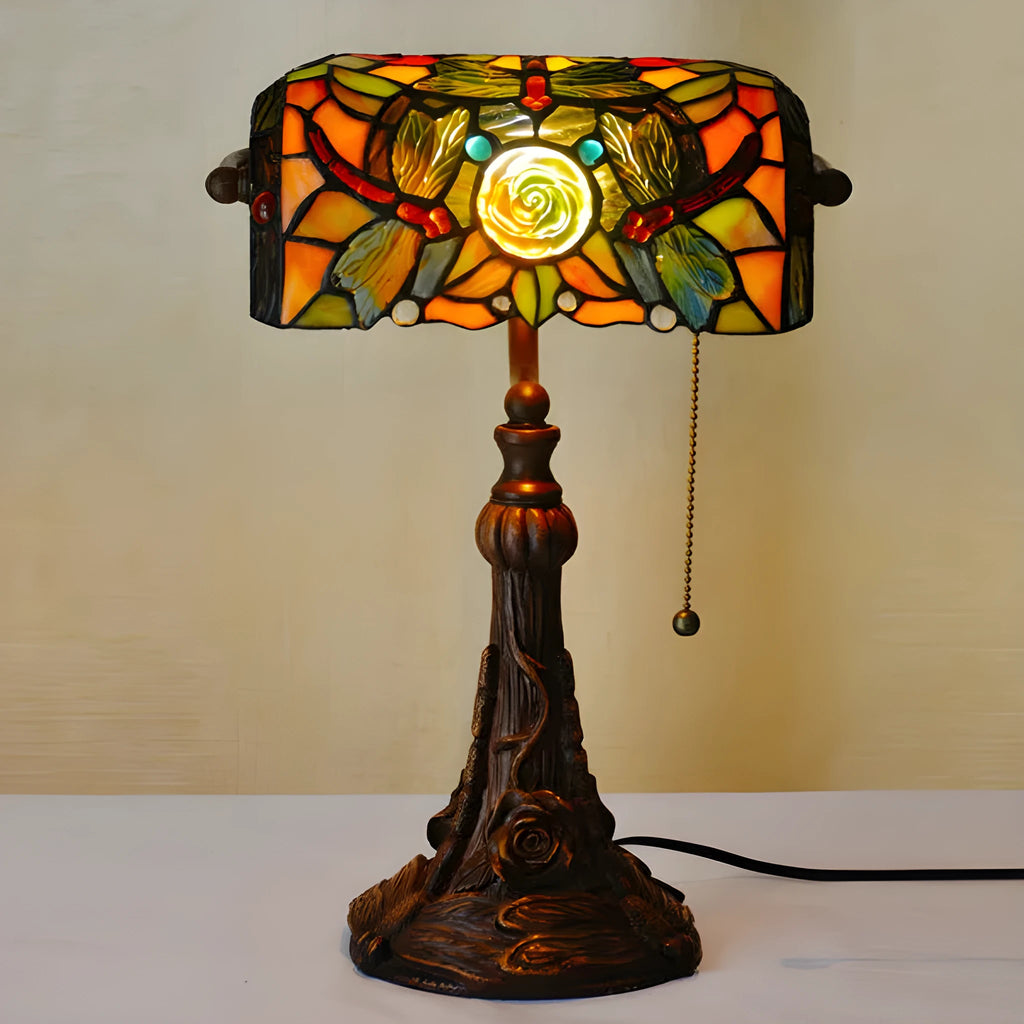 10-inch Tiffany style stained glass table lamp with resin base on a wooden desk.