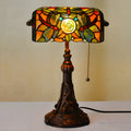 10-inch Tiffany style stained glass table lamp with resin base on a wooden desk.
