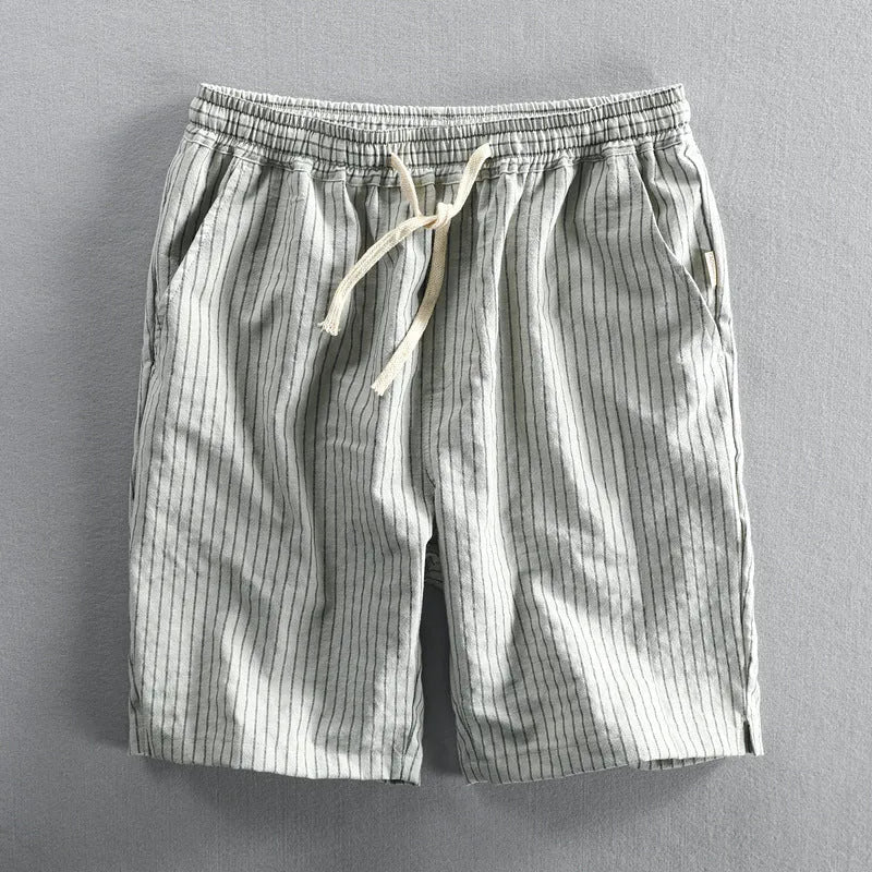 Men's striped cotton casual loose shorts on a hanger showing mid waist and shorts length.