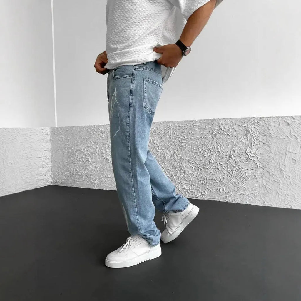 Men's blue straight-leg denim jeans with wide leg cut and mid waist design