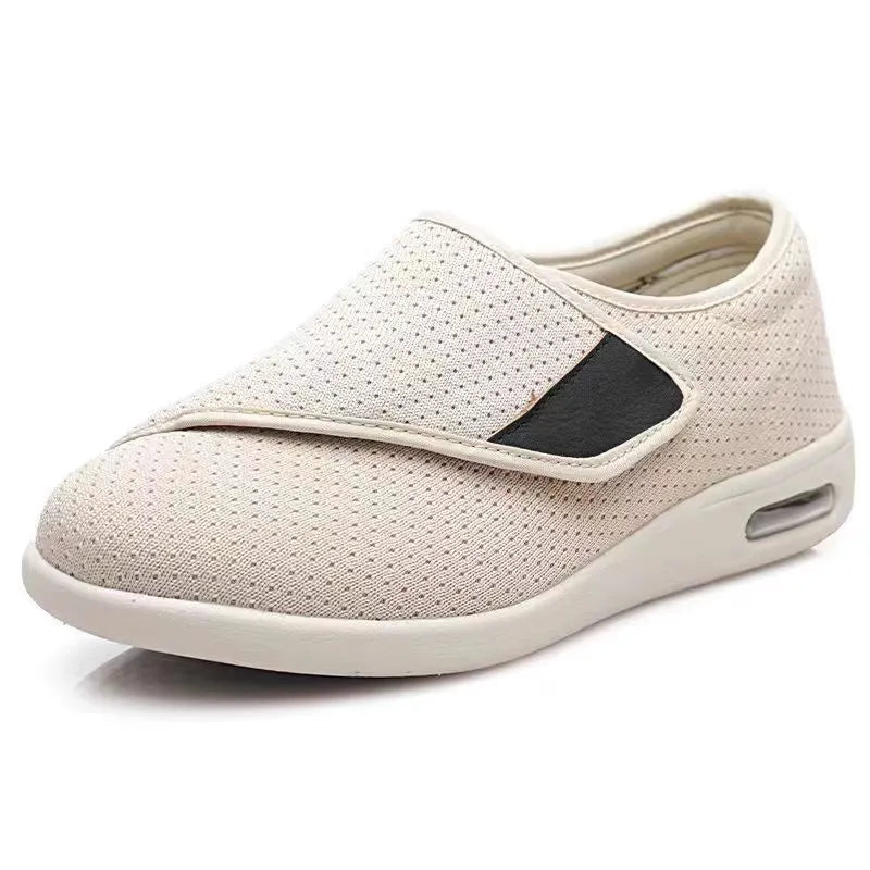 Beige leisure shoe with a velcro strap closure and a rounded toe, shown on a neutral background