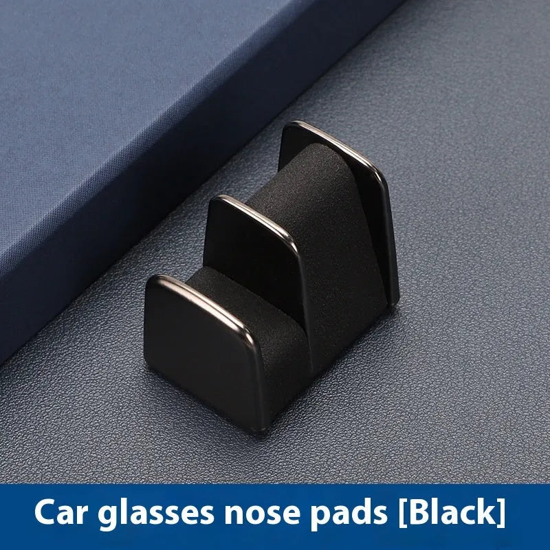 Zinc alloy car glasses clip with leather pad in choice of colours for dashboard or visor.