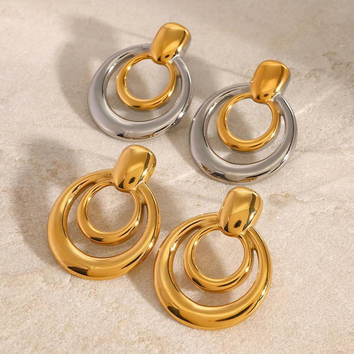 Golden round double-layer hollow stud earrings with geometric design and 18K gold plating