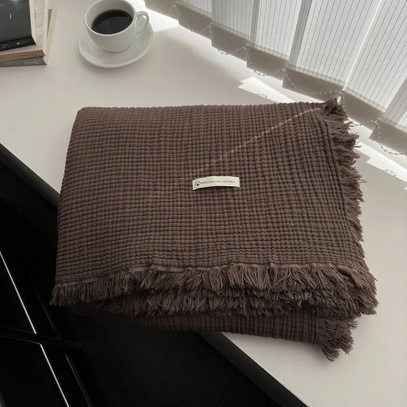 Four-layer gauze cotton blanket with tassel trim in navy blue colour